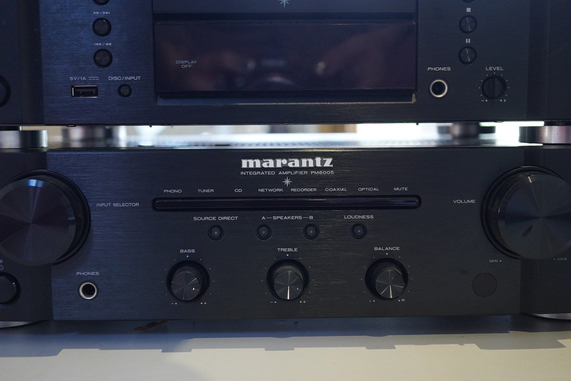 A Marantz HiFi integrated amplifier PM6005, together with a CD player CD6005, plus two remote controls and power leads